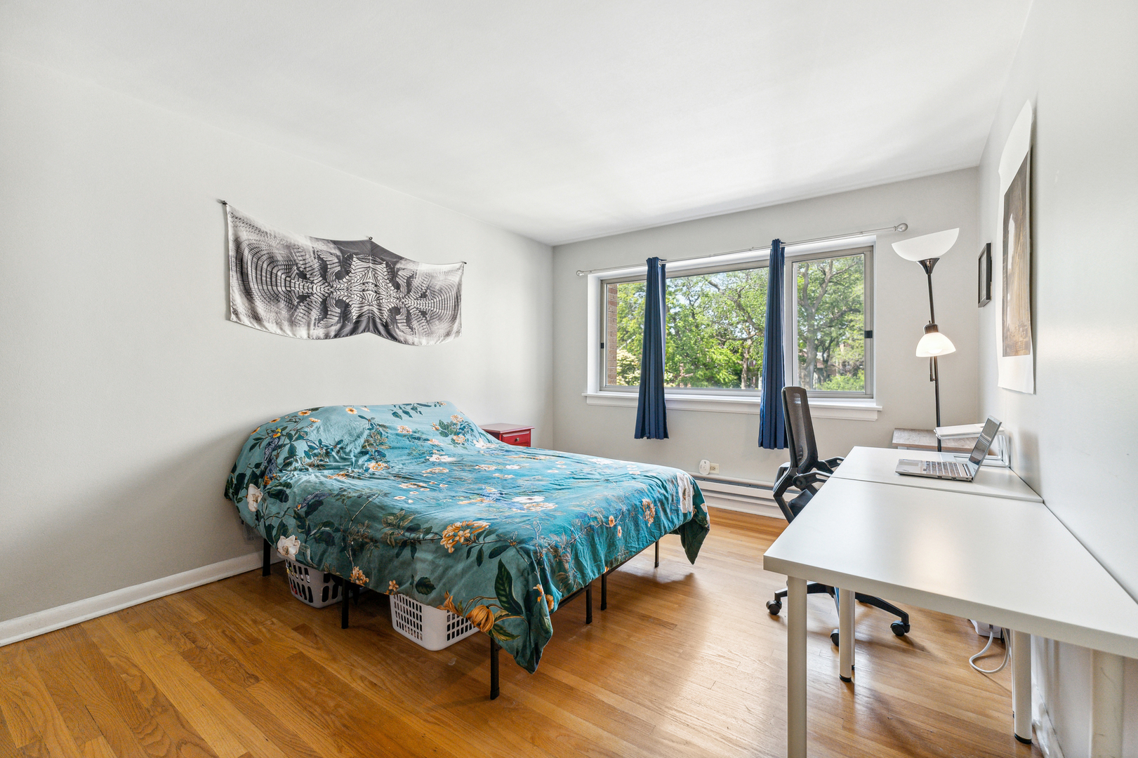 737 Ridge Avenue, Unit 3F Evanston, IL 60202 - Photo 10 of 20 a bedroom with a bed table and chair