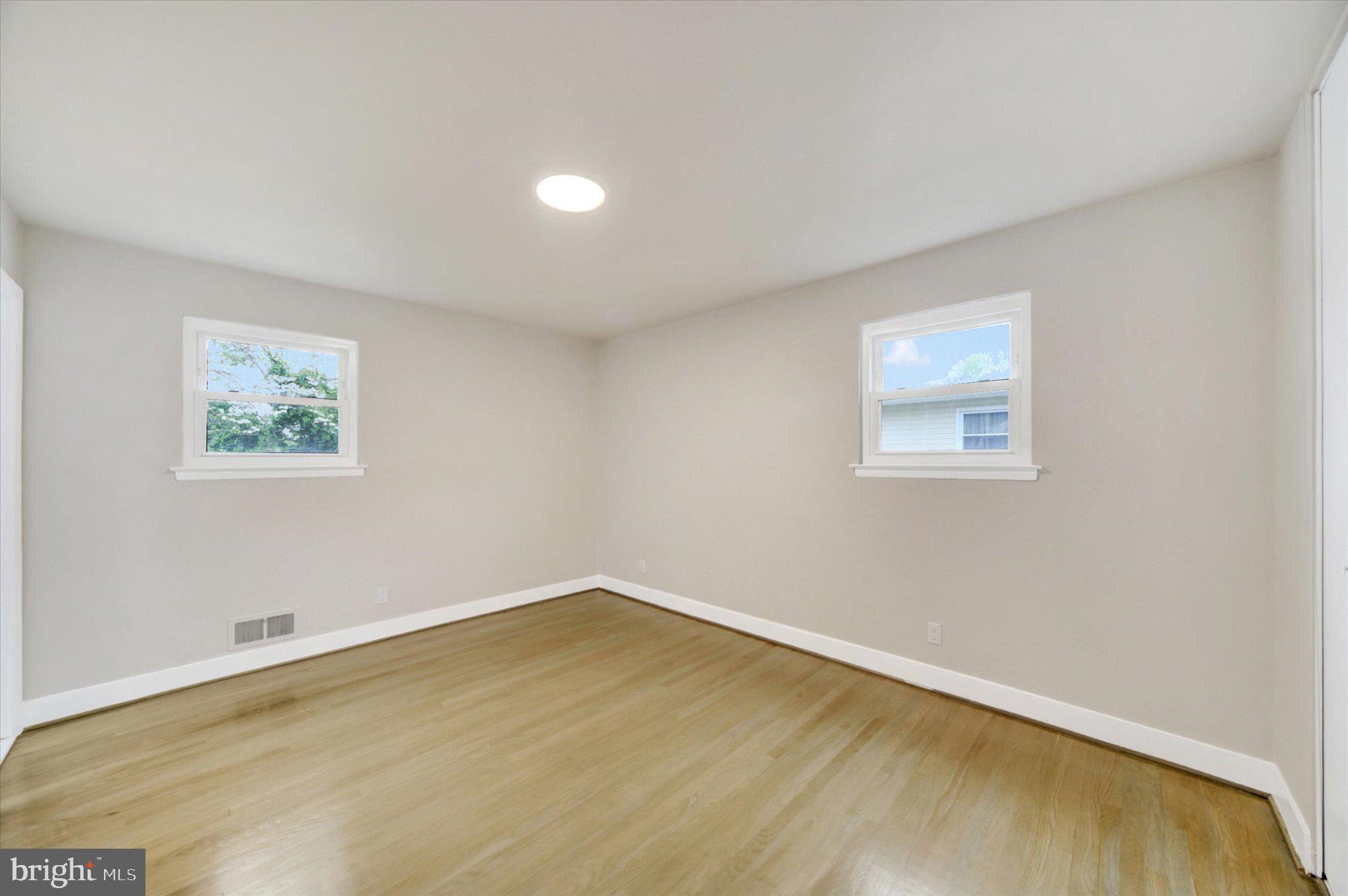 3709 Lamoine Road Randallstown, MD 21133 - Photo 13 of 25 a view of a room with wooden floor and window