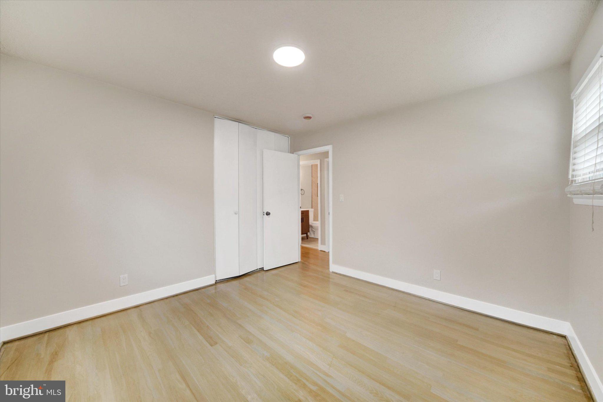 3709 Lamoine Road Randallstown, MD 21133 - Photo 17 of 25 a view of an empty room with wooden floor