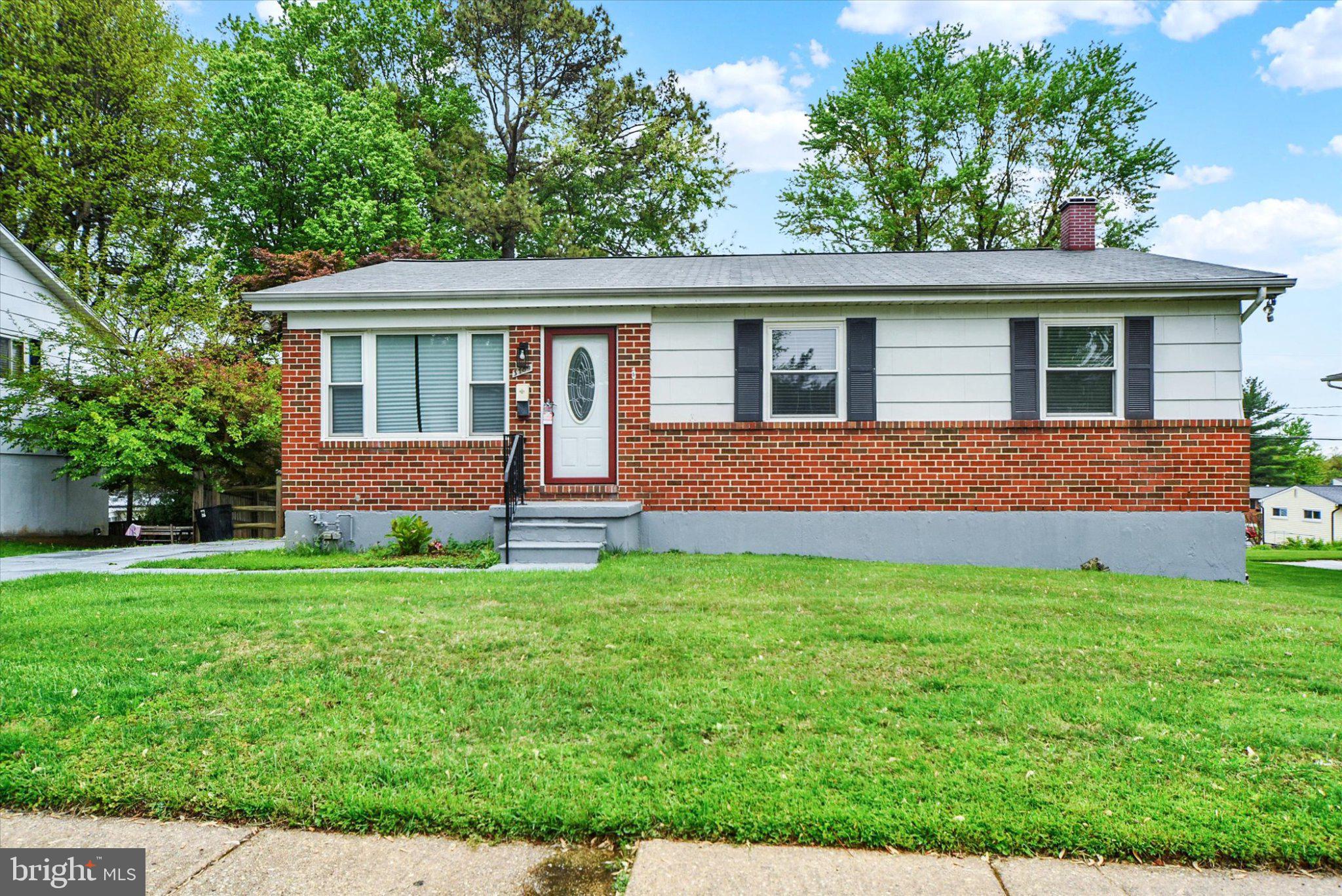 3709 Lamoine Road Randallstown, MD 21133 - Photo 2 of 25 a front view of a house with a garden