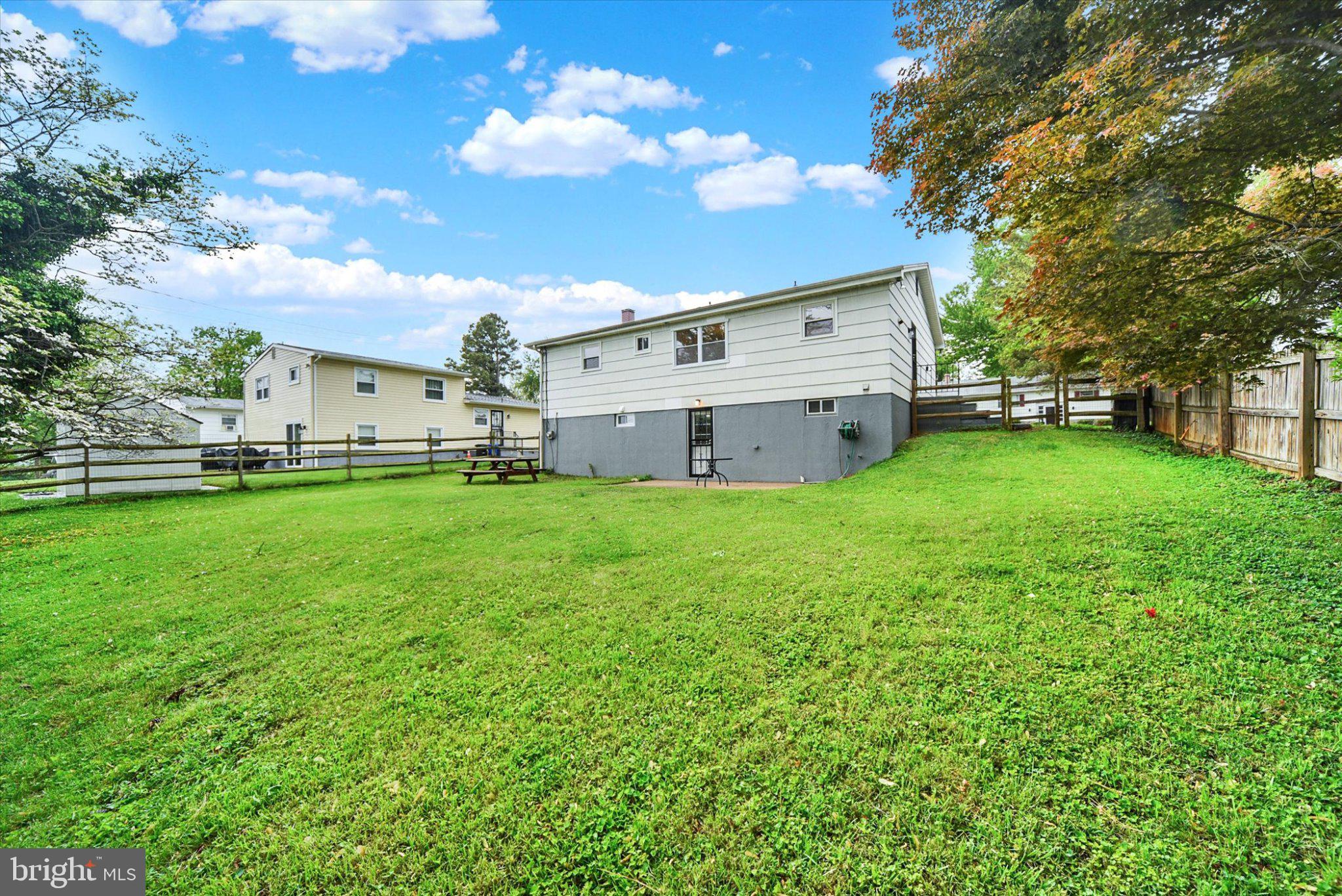 3709 Lamoine Road Randallstown, MD 21133 - Photo 25 of 25 a view of a house with a big yard with large trees
