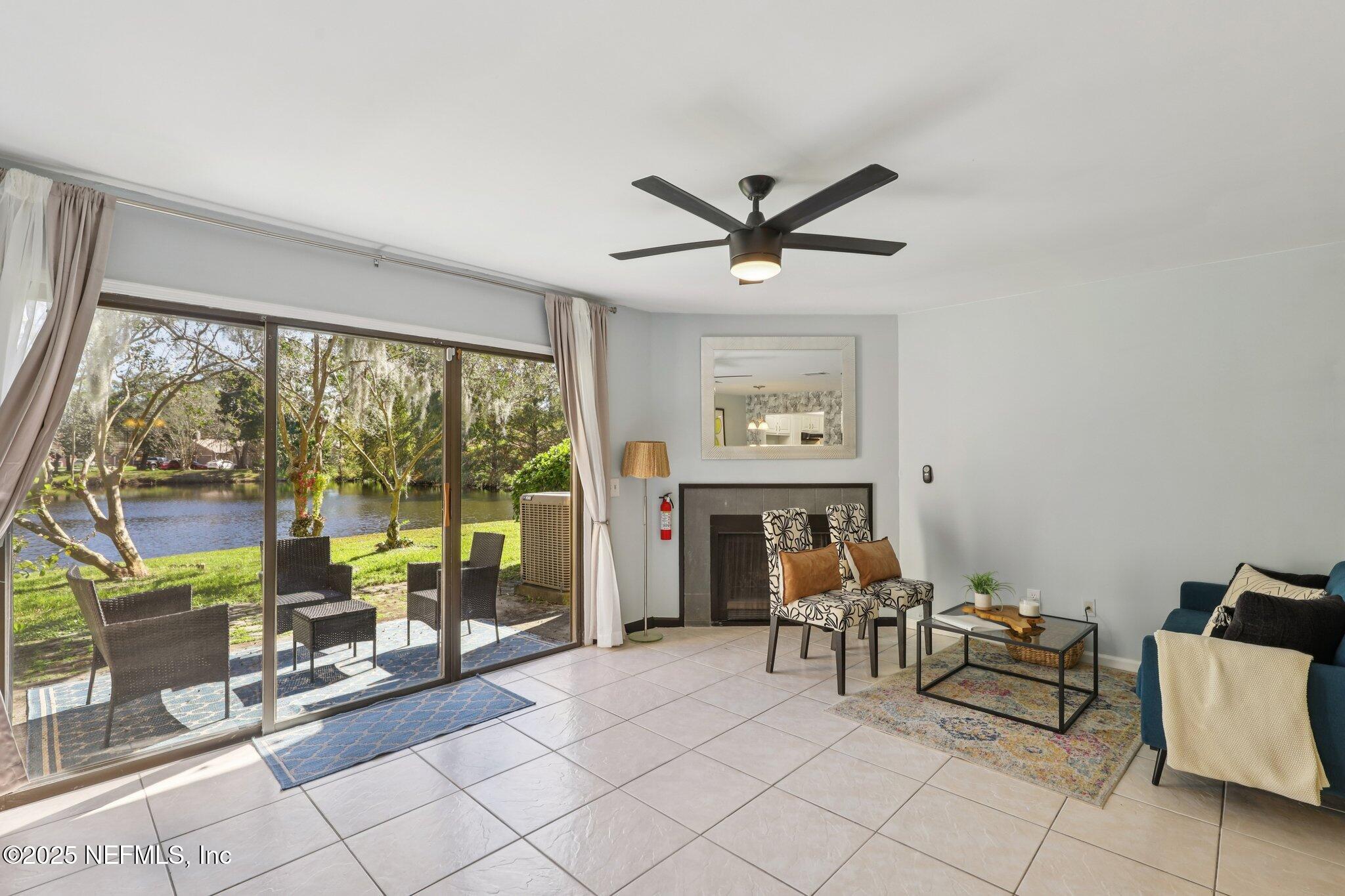 3801 Crown Point Road, Unit 1263 Jacksonville, FL 32257 - Photo 13 of 33 a living room with furniture and a large window