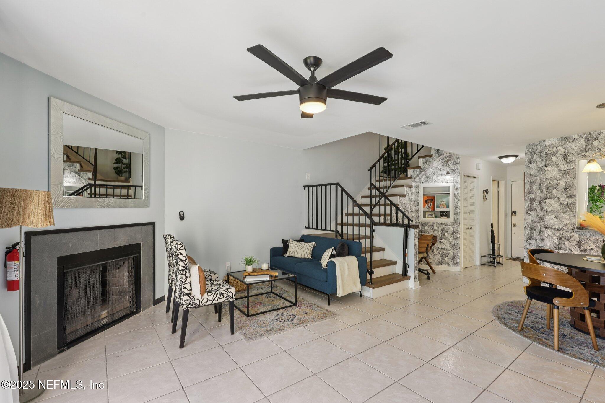 3801 Crown Point Road, Unit 1263 Jacksonville, FL 32257 - Photo 14 of 33 a living room with furniture and a fireplace