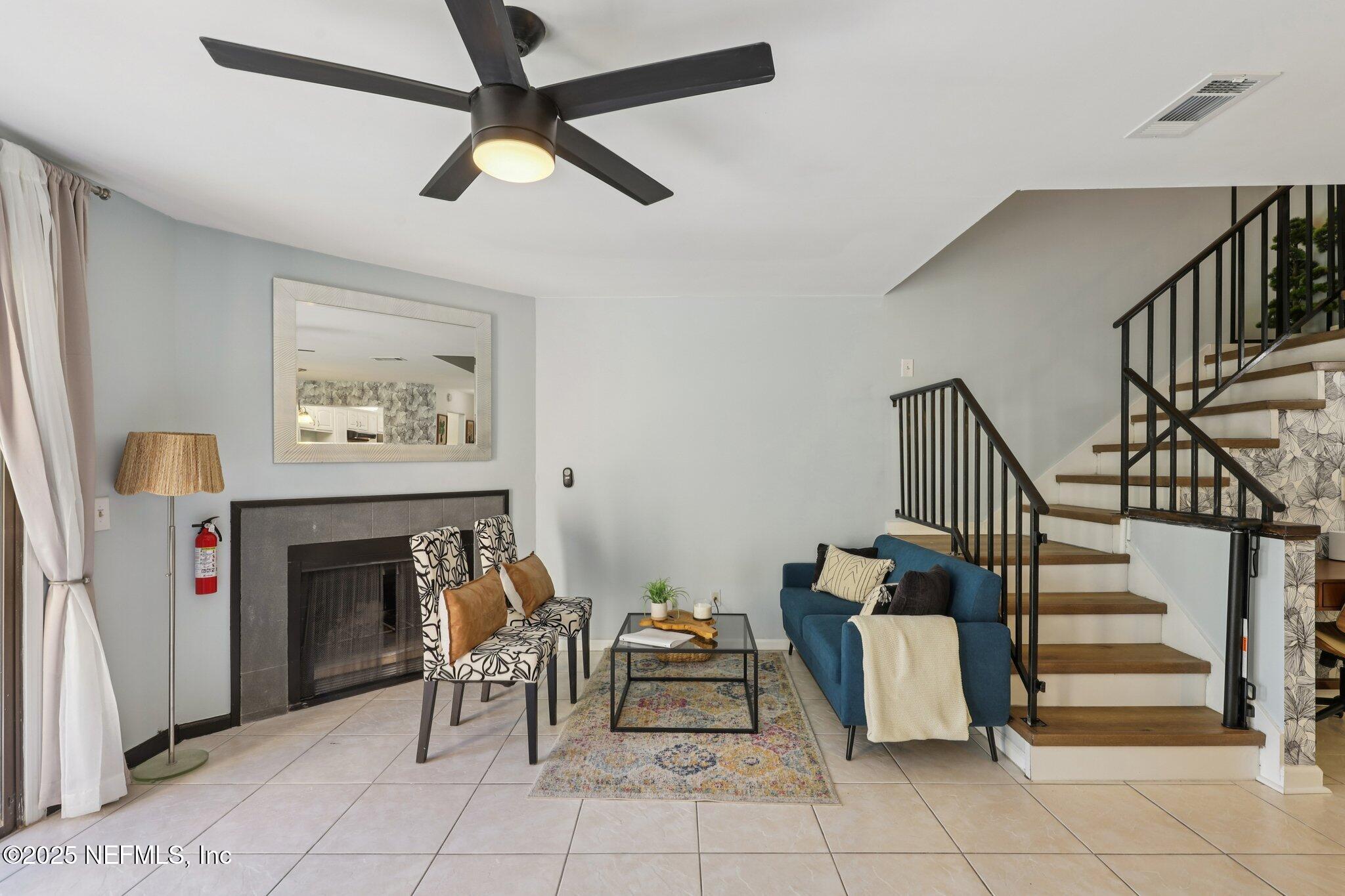 3801 Crown Point Road, Unit 1263 Jacksonville, FL 32257 - Photo 16 of 33 a bedroom with furniture and a fireplace