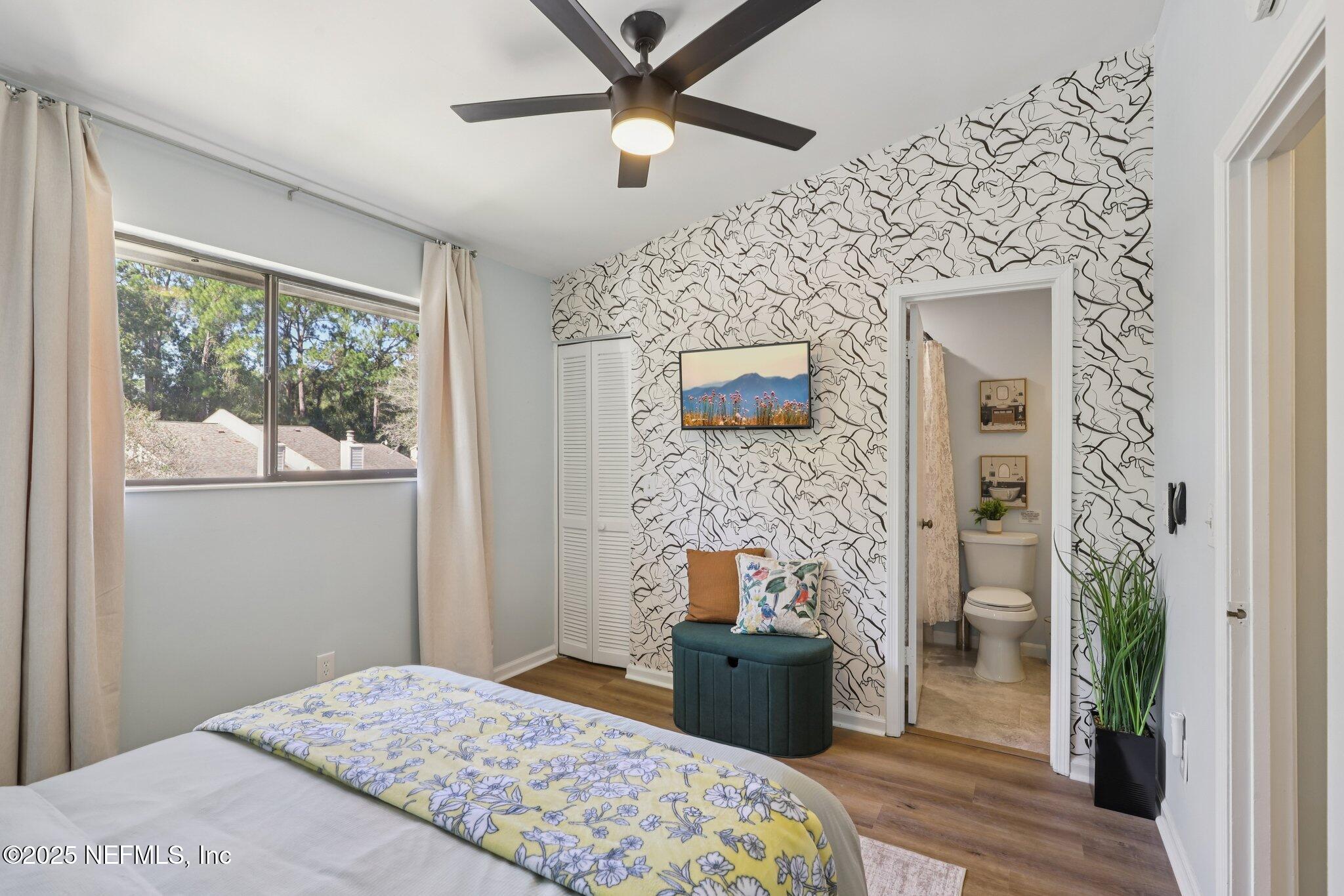 3801 Crown Point Road, Unit 1263 Jacksonville, FL 32257 - Photo 22 of 33 a bedroom with a bed and a fireplace