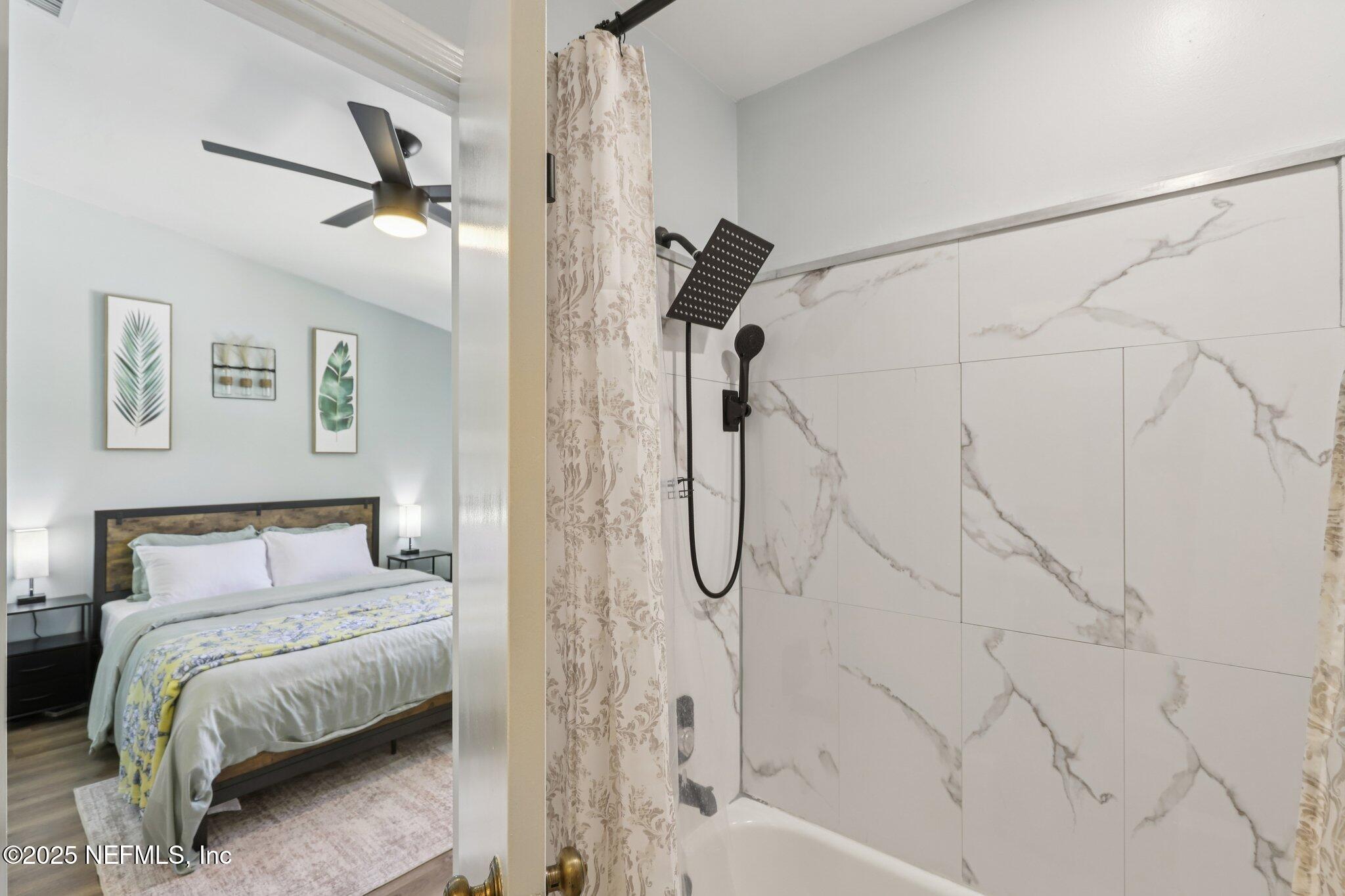 3801 Crown Point Road, Unit 1263 Jacksonville, FL 32257 - Photo 24 of 33 a bathroom with a bathtub and a shower