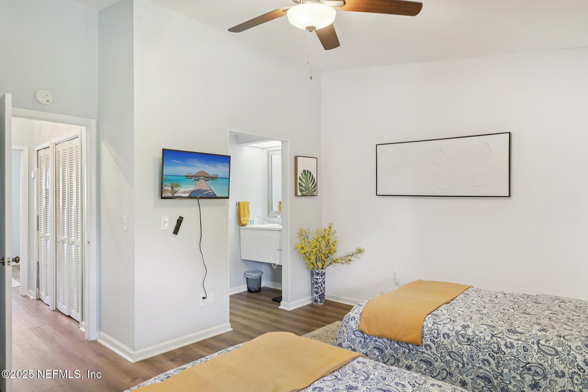 3801 Crown Point Road, Unit 1263 Jacksonville, FL 32257 - Photo 26 of 33 a bedroom with a bed and a chandelier