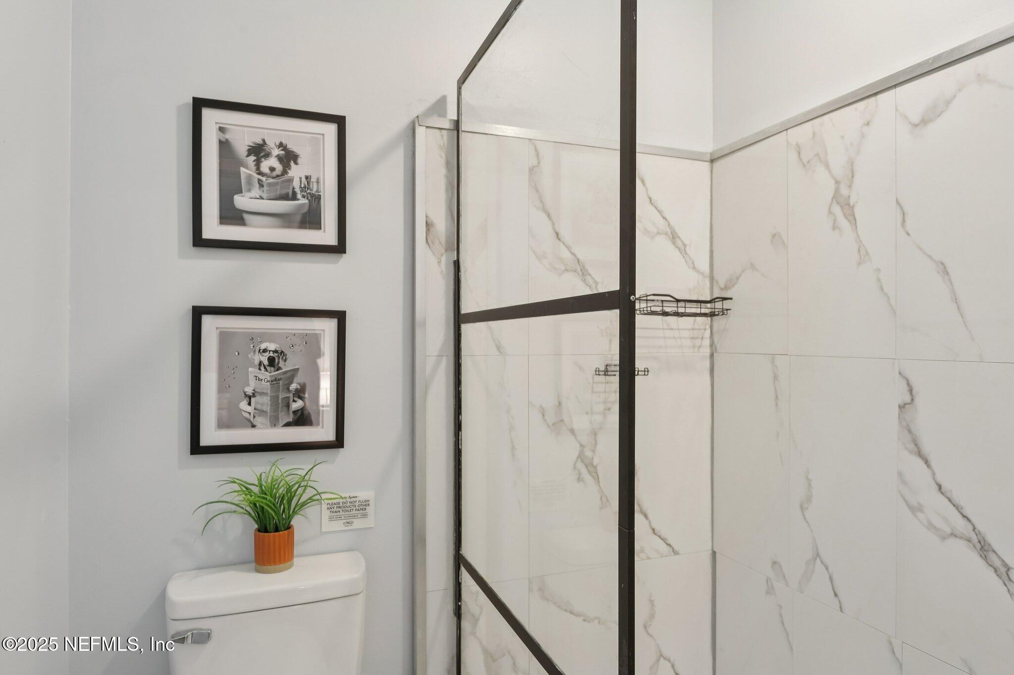 3801 Crown Point Road, Unit 1263 Jacksonville, FL 32257 - Photo 28 of 33 a view of a hallway with paintings on the wall