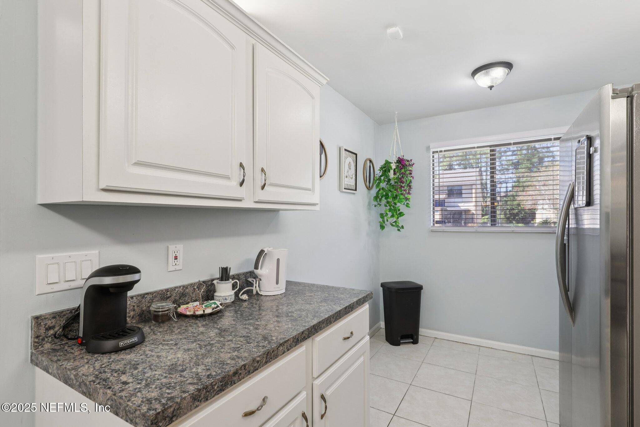 3801 Crown Point Road, Unit 1263 Jacksonville, FL 32257 - Photo 9 of 33 a kitchen with a sink dishwasher and cabinets