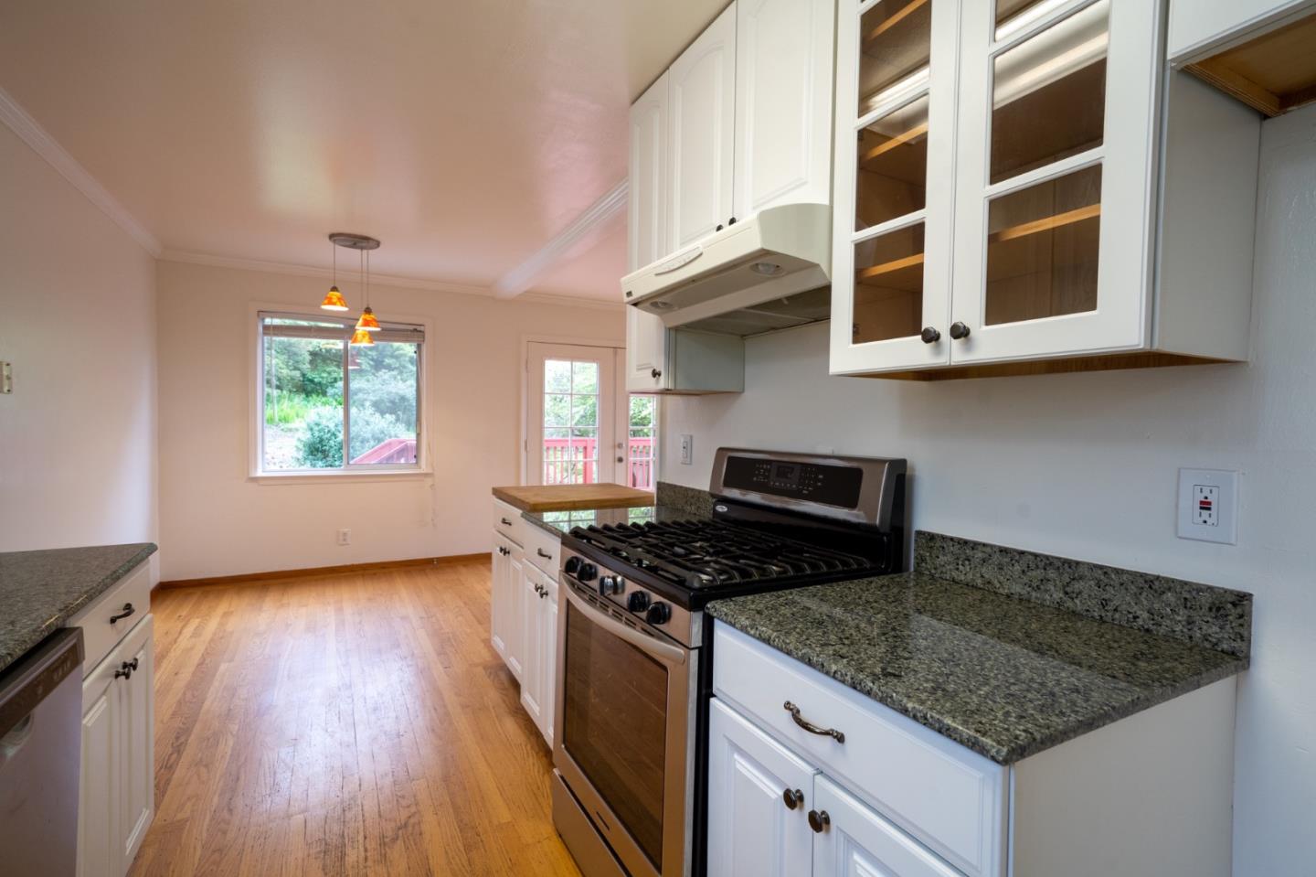 616 Brighton Road Pacifica, CA 94044 - Photo 7 of 14 a kitchen with stainless steel appliances granite countertop a stove a sink and a microwave