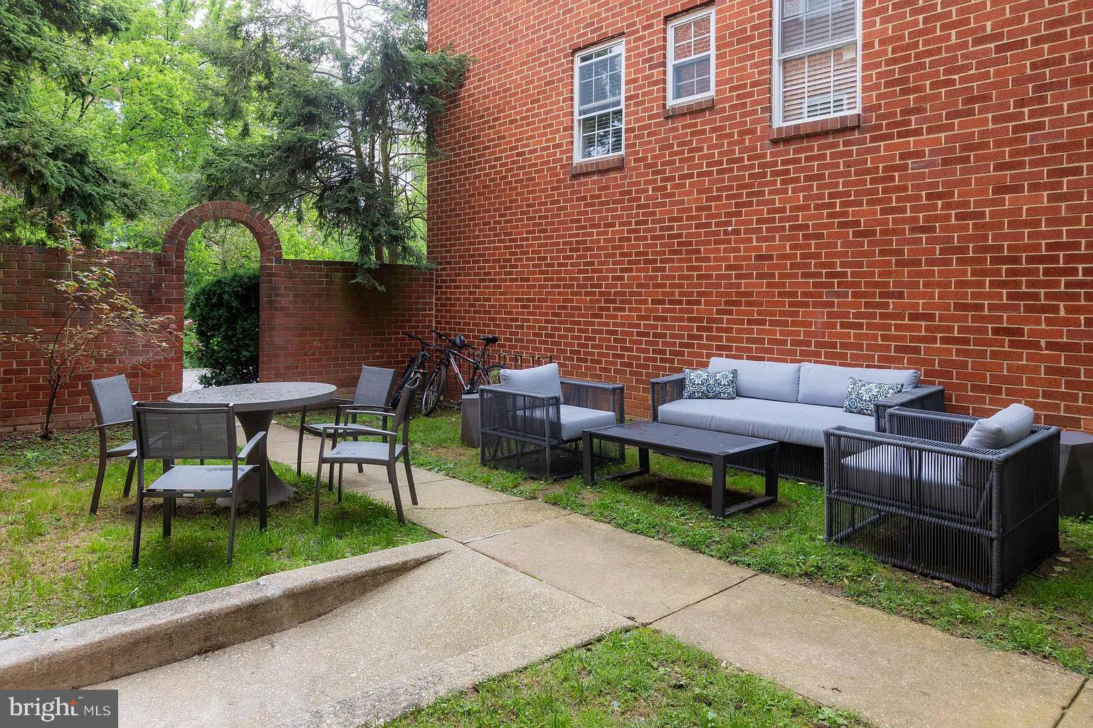 4014 Linkwood Road, Unit D Baltimore, MD 21210 - Photo 17 of 18 a view of a patio with table and chairs and potted plants