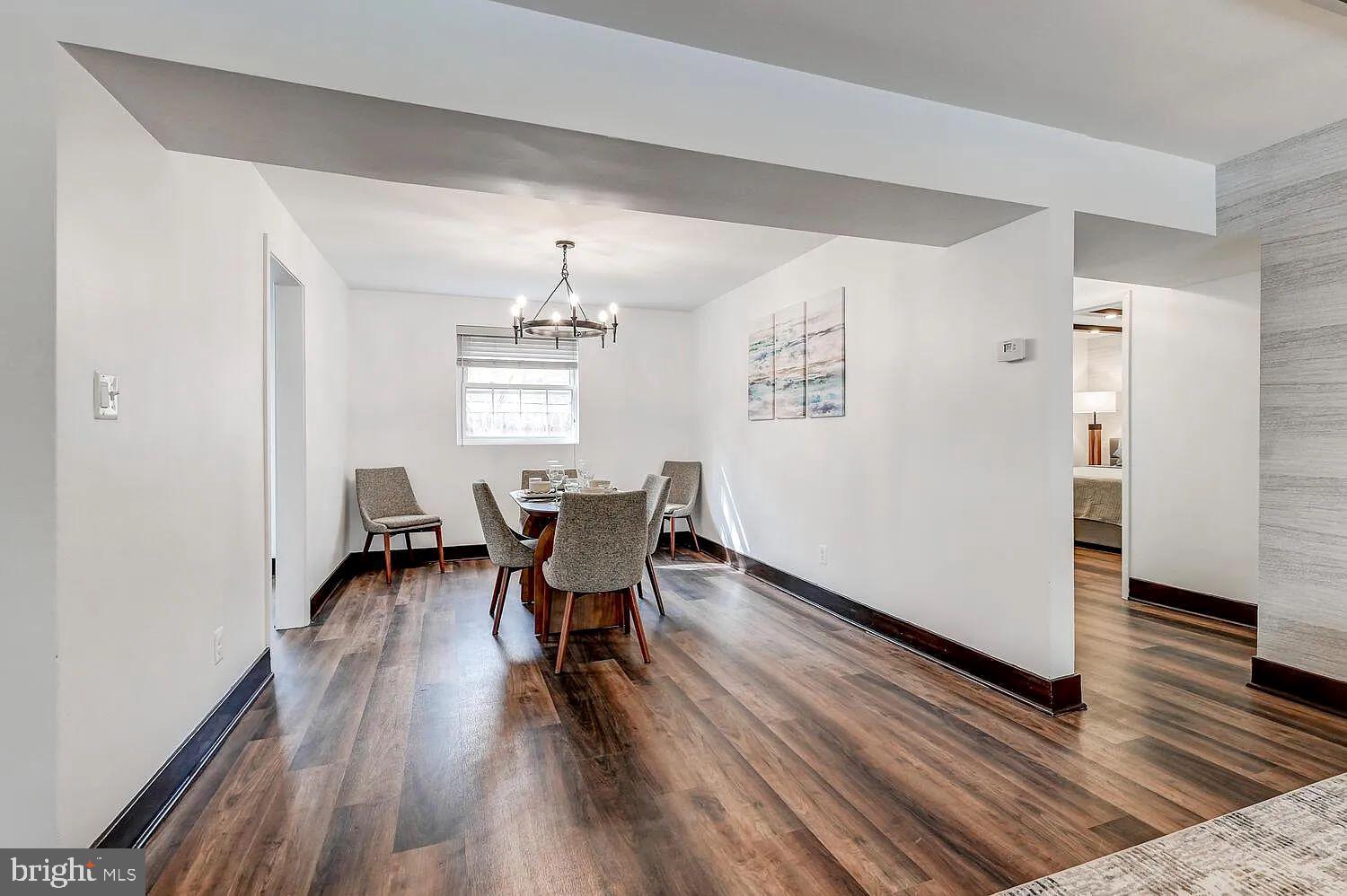 4014 Linkwood Road, Unit D Baltimore, MD 21210 - Photo 7 of 18 a view of a dining room with furniture and wooden floor