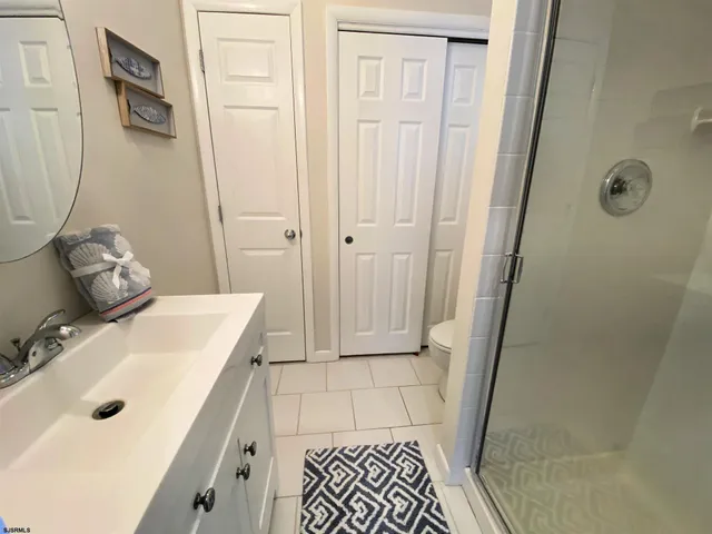 a bathroom with a sink and shower