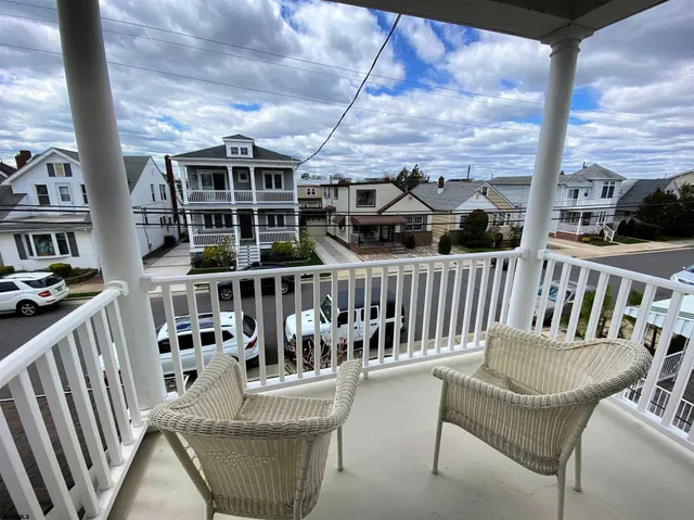 a view of a balcony with furniture