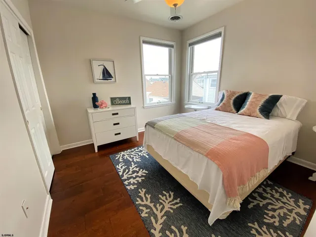 a bed room with a bed and a window