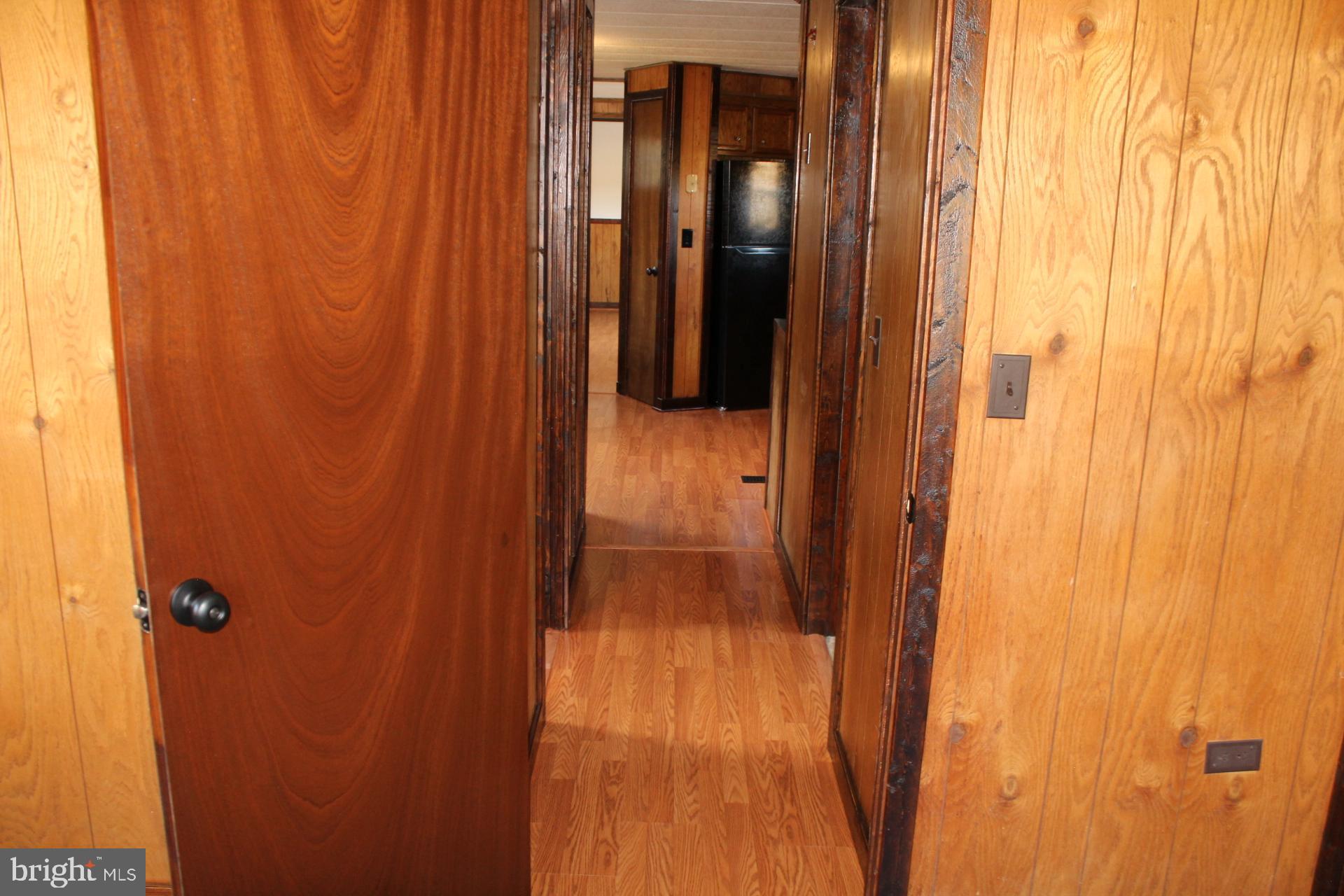 5274 Burr Hill Road Rhoadesville, VA 22542 - Photo 34 of 66 Bedroom two. View down hallway.