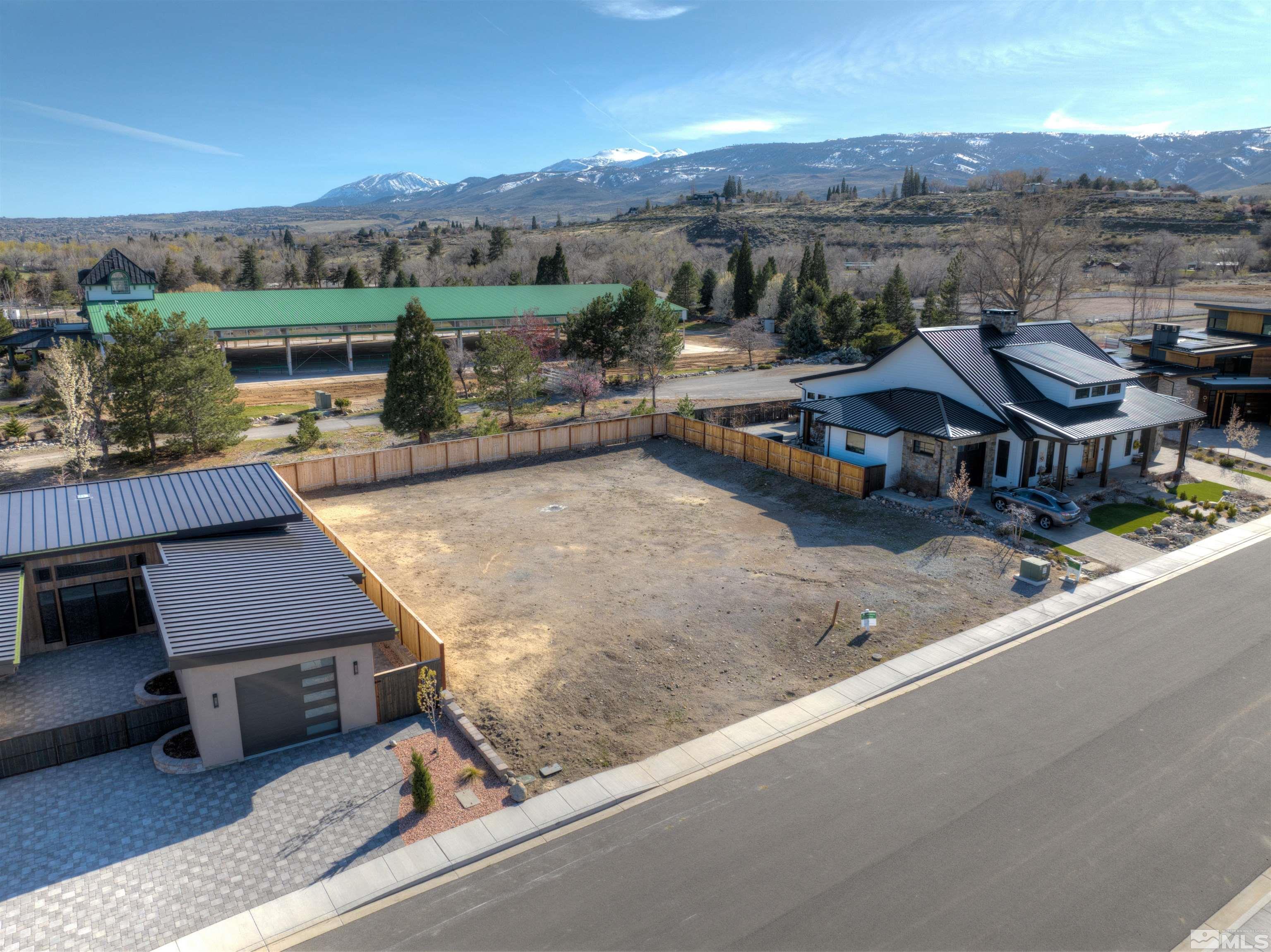 726 Canter Way Reno, NV 89511 - Photo 2 of 11 an aerial view of a house with a garden and lake view