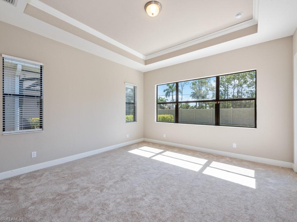 1638 Serrano Circle Naples, FL 34105 - Photo 15 of 23 a view of an empty room with a window