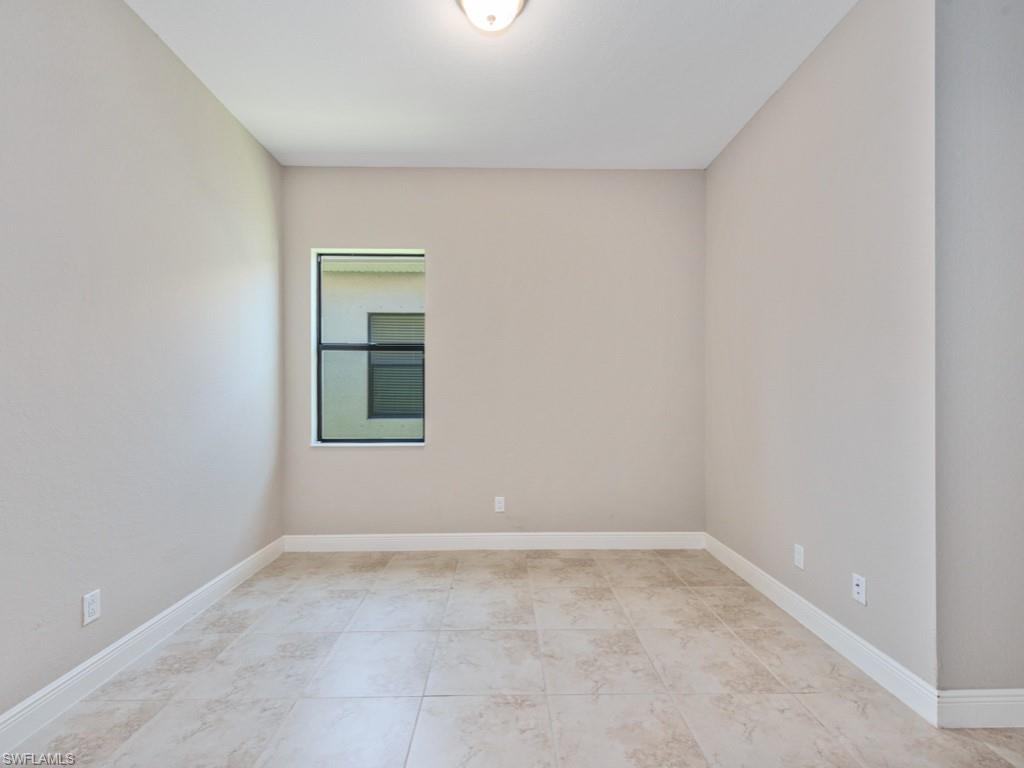 1638 Serrano Circle Naples, FL 34105 - Photo 18 of 23 an empty room with a window