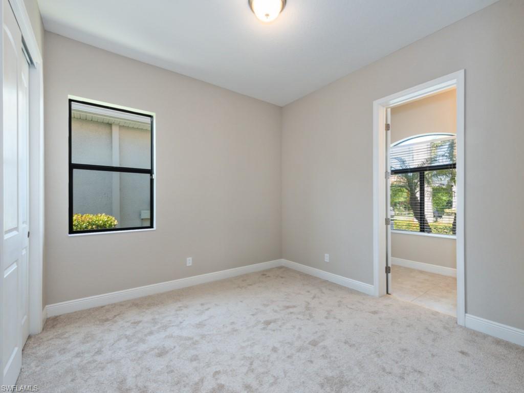 1638 Serrano Circle Naples, FL 34105 - Photo 20 of 23 a view of an empty room with a window