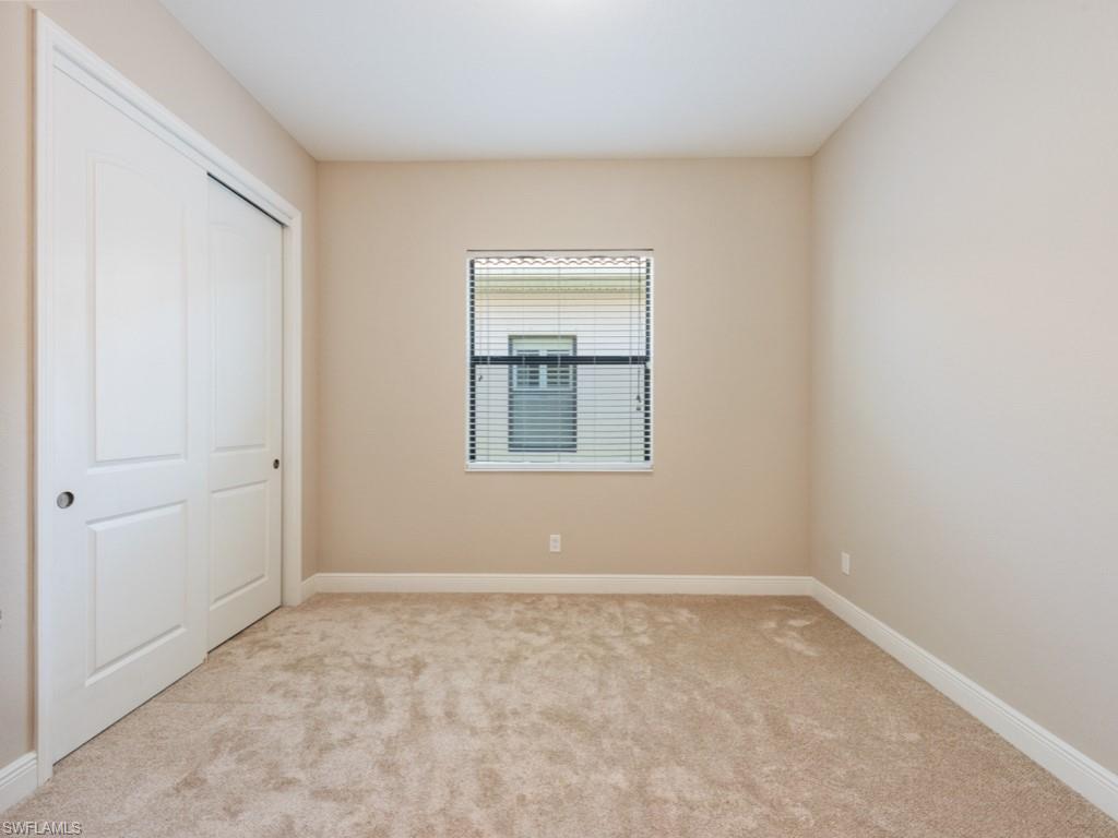 1638 Serrano Circle Naples, FL 34105 - Photo 22 of 23 a view of an empty room with a window