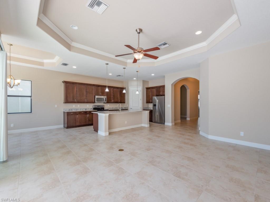 1638 Serrano Circle Naples, FL 34105 - Photo 5 of 23 a view of kitchen with cabinets microwave and refrigerator