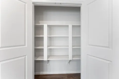 a view of an empty walk in closet