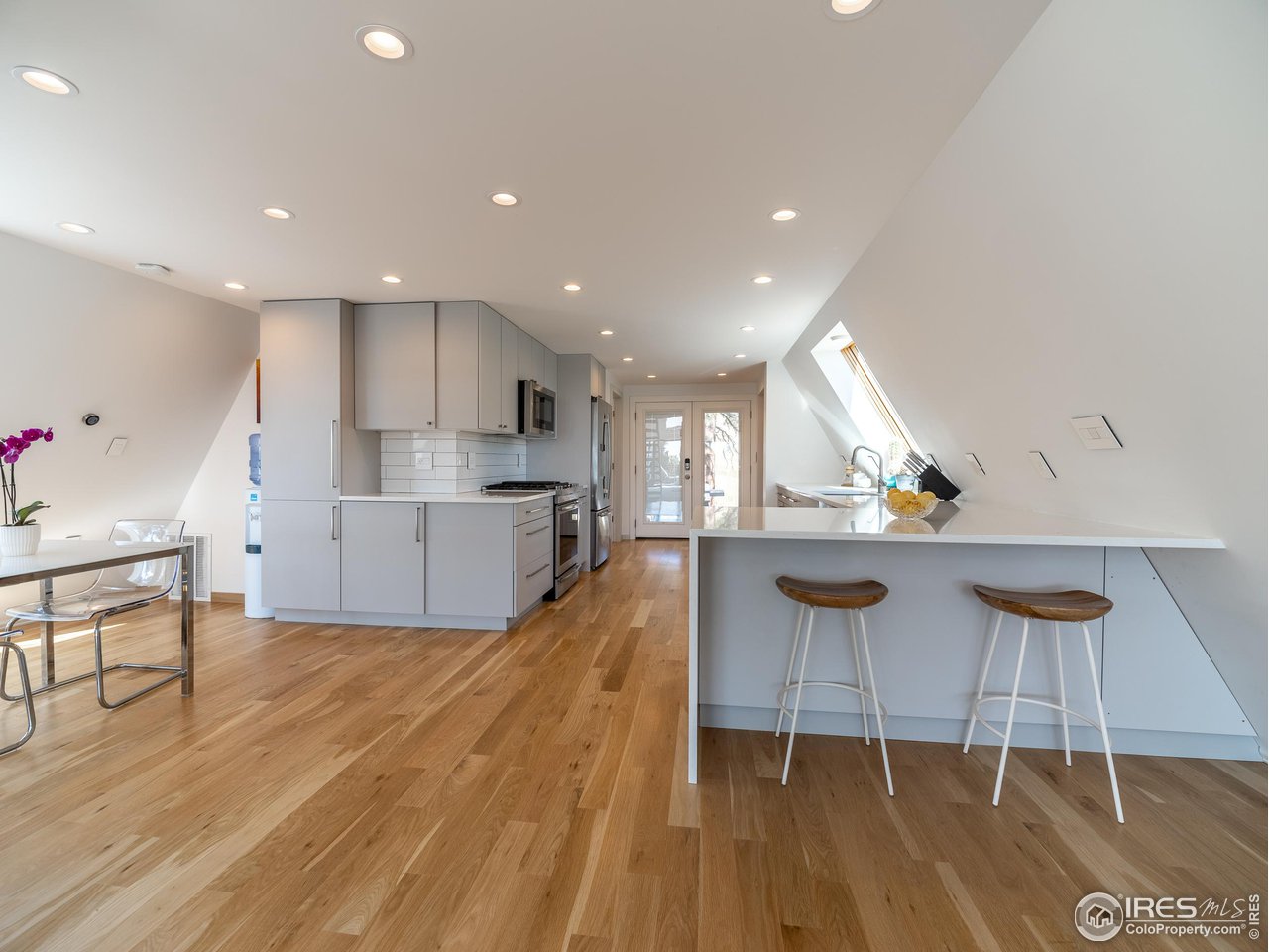 8423 Middle Fork Road Boulder, CO 80302 - Photo 15 of 40 a view of kitchen with wooden floor and outdoor space