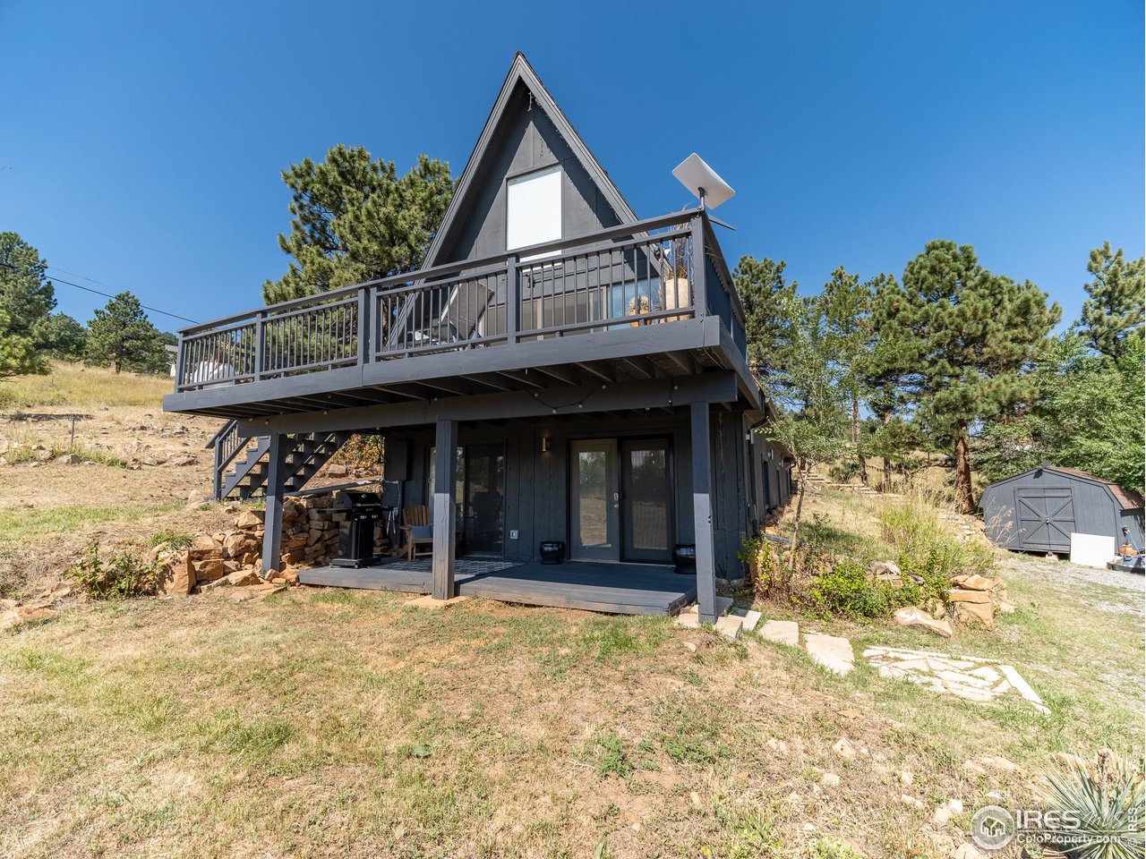 8423 Middle Fork Road Boulder, CO 80302 - Photo 2 of 40 a view of a house with large windows