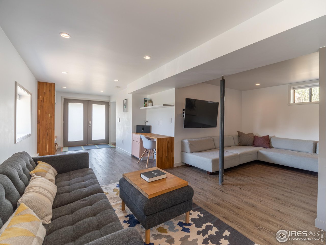 8423 Middle Fork Road Boulder, CO 80302 - Photo 24 of 40 a living room with furniture and a flat screen tv