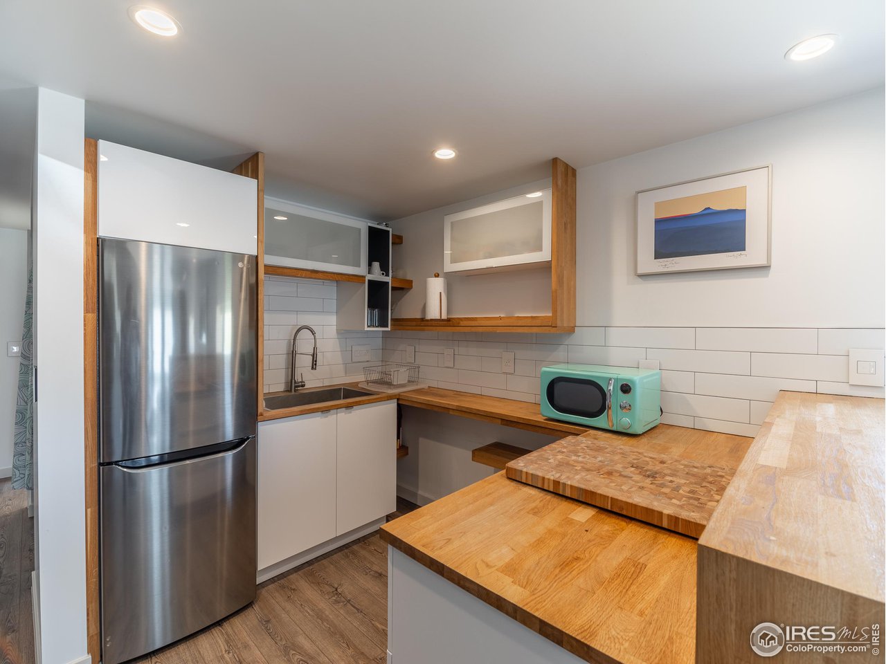 8423 Middle Fork Road Boulder, CO 80302 - Photo 27 of 40 a kitchen with a refrigerator and a sink