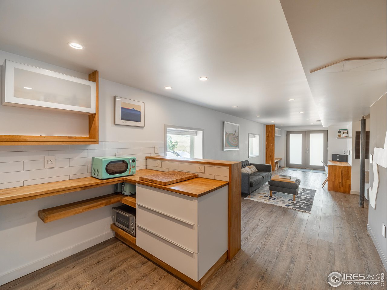 8423 Middle Fork Road Boulder, CO 80302 - Photo 28 of 40 a reading room with furniture and wooden floor