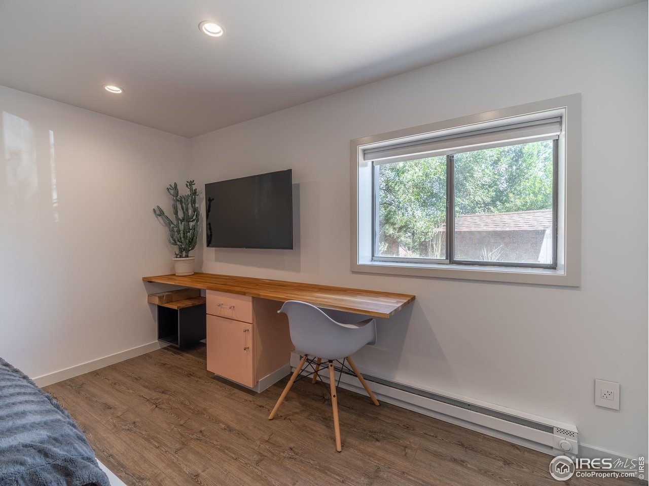 8423 Middle Fork Road Boulder, CO 80302 - Photo 33 of 40 a living room with furniture a flat screen tv and a large window