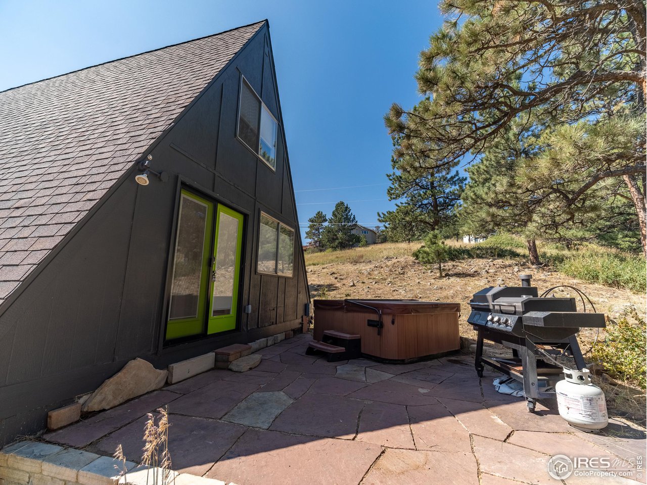 8423 Middle Fork Road Boulder, CO 80302 - Photo 36 of 40 a view of backyard with barbeque grill and outdoor seating