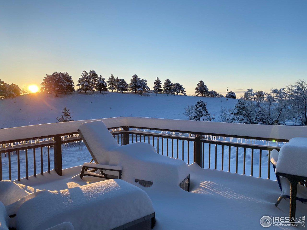 8423 Middle Fork Road Boulder, CO 80302 - Photo 39 of 40 a balcony with wooden floor table and chairs