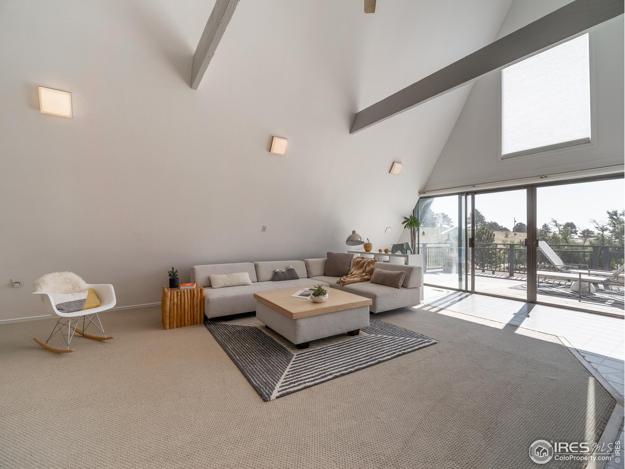 8423 Middle Fork Road Boulder, CO 80302 - Photo 6 of 40 a living room with furniture and a floor to ceiling window