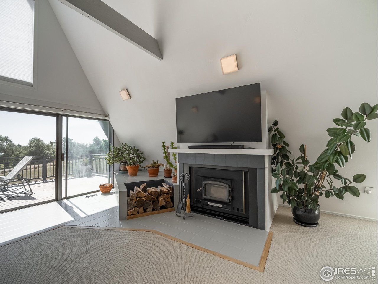 8423 Middle Fork Road Boulder, CO 80302 - Photo 7 of 40 a living room with furniture and a fireplace