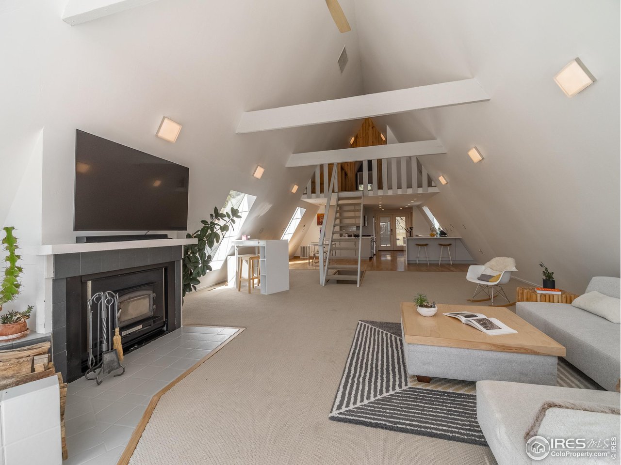 8423 Middle Fork Road Boulder, CO 80302 - Photo 10 of 40 a living room with furniture and a flat screen tv