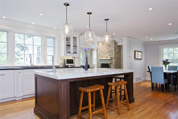 32 Arlington Road Wellesley, MA 02481 - Photo 11 of 29 a kitchen with stainless steel appliances granite countertop a table chairs and a large window