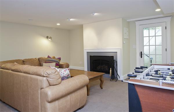 32 Arlington Road Wellesley, MA 02481 - Photo 26 of 29 a living room with furniture and a fireplace