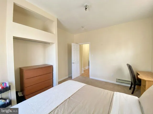 a bedroom with a bed and furniture