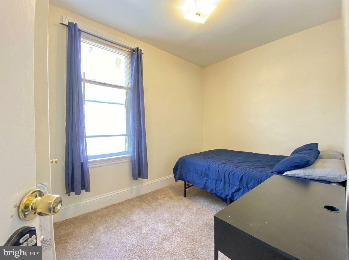 1849 North 17th Street, Unit 4 Philadelphia, PA 19121 - Photo 6 of 12 a room with a bed and a window