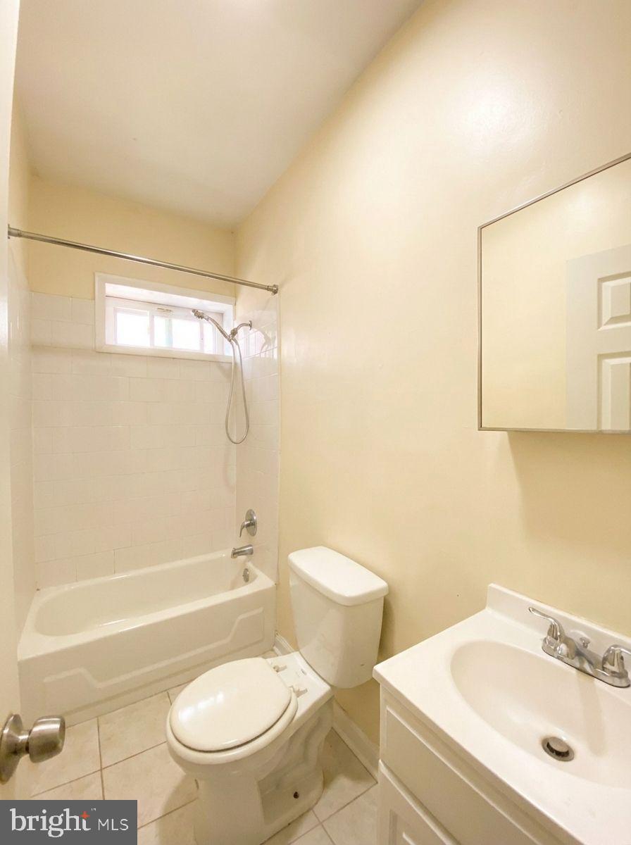 1849 North 17th Street, Unit 4 Philadelphia, PA 19121 - Photo 8 of 12 a bathroom with a sink a toilet and shower