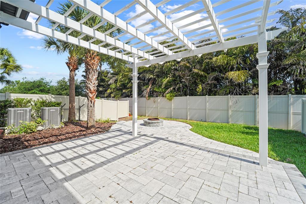 8903 Arabella Lane Seminole, FL 33777 - Photo 11 of 47 a outdoor view of a house with a backyard