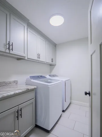 a utility room with cabinets
