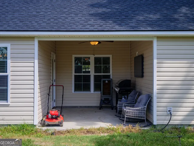 a backyard of a house with seating space