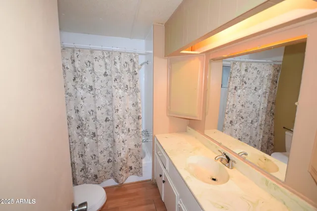 a bathroom with a bathtub and shower