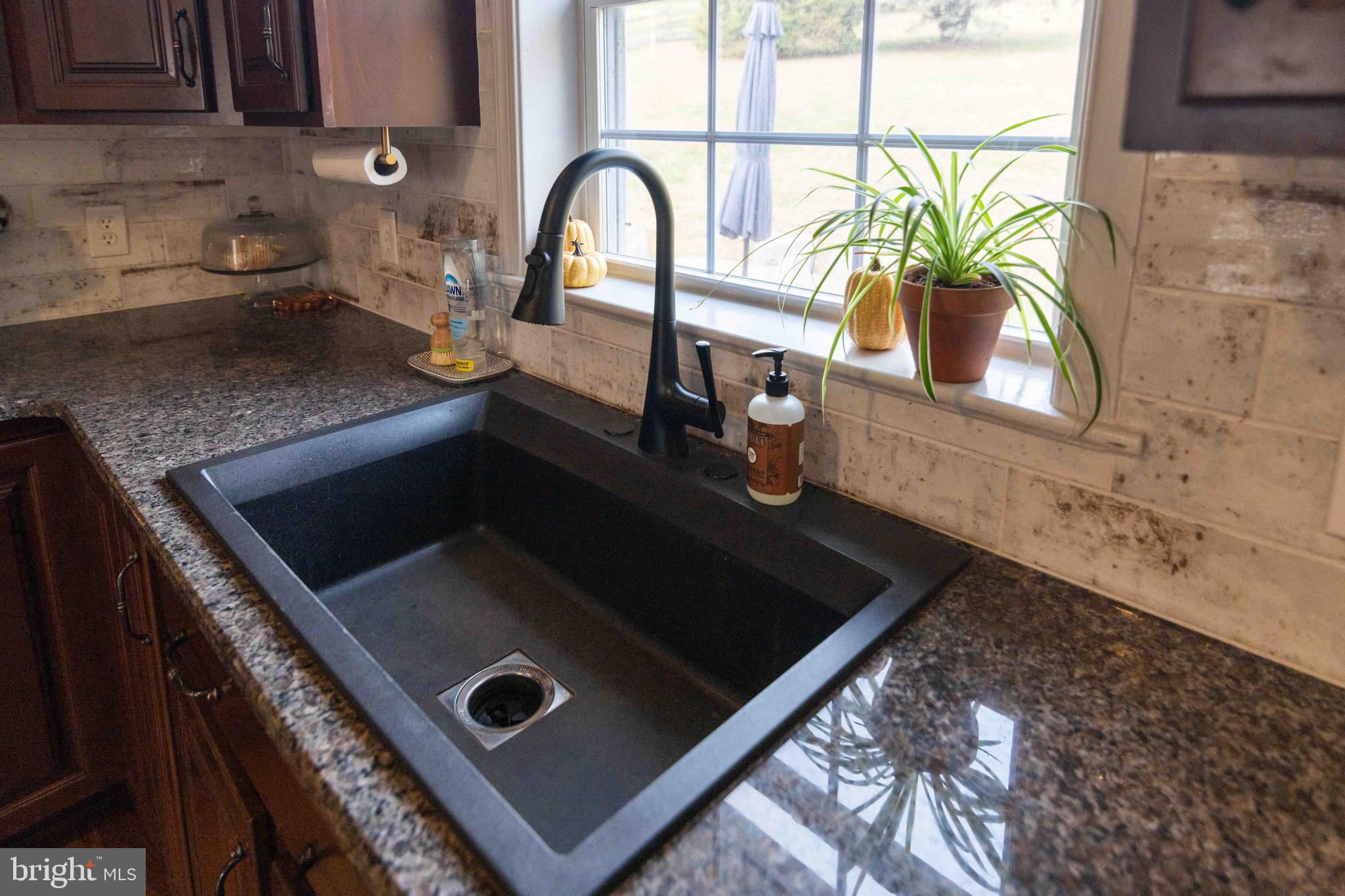 151 South Sandy Hill Road Coatesville, PA 19320 - Photo 13 of 91 a close view of a sink a counter and appliances in the kitchen