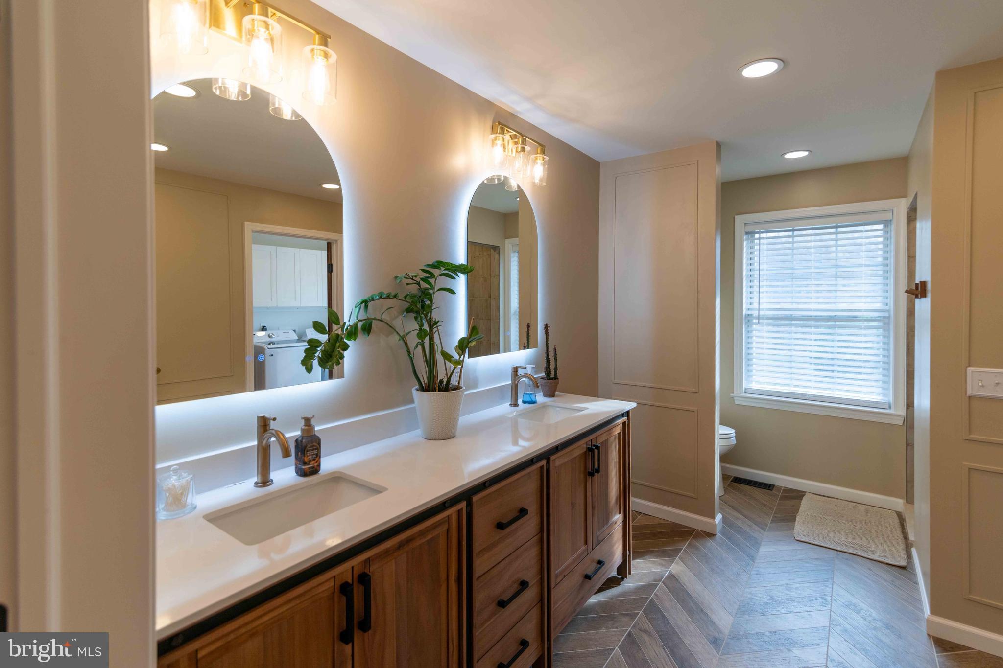 151 South Sandy Hill Road Coatesville, PA 19320 - Photo 29 of 91 a spacious bathroom with a double vanity sink and a mirror