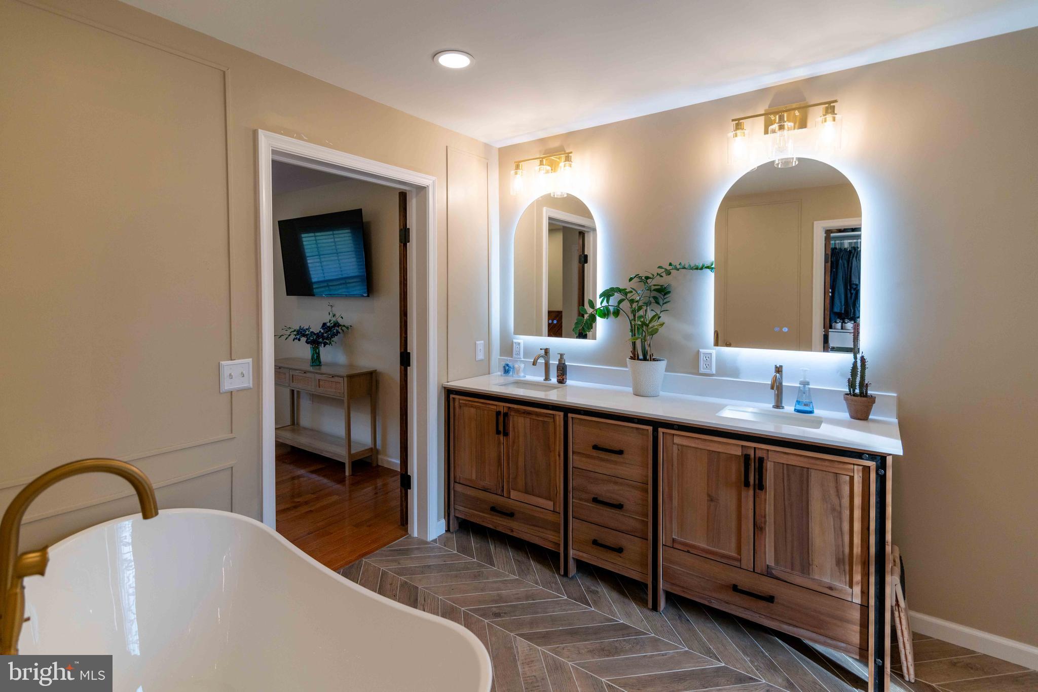 151 South Sandy Hill Road Coatesville, PA 19320 - Photo 33 of 91 a spacious bathroom with a double vanity sink and a mirror